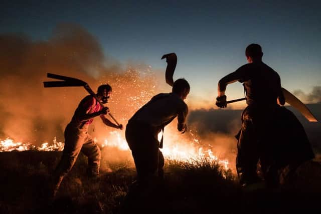 Devastating blazes at Winter Hill and Saddleworth Moor were battled by firefighters and soldiers for days in June and July this year - and more frequent wildfires associated with climate change threaten to degrade peatland areas further. Picture by Danny Lawson/PA Wire.
