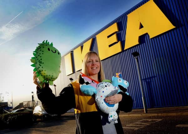 Play time: Helen Blanchard, a member of staff at IKEA Leeds, with soft toys which the company sells to raise money for the IKEA Foundation. Picture: Tony Johnson.