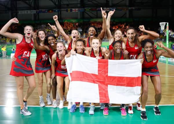 Champions: The England netball team celebrate winning gold.
