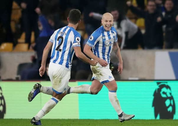 WANTED MAN: Huddersfield Town's Aaron Mooy (right) celebrates scoring his side's second goal against Wolves earlier this season. Picture: Nick Potts/PA