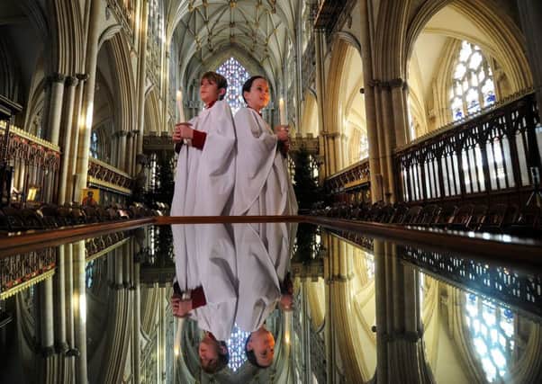 Choristers Michael Adams and Olivia Bryan at York Minster ahead of the Christmas services.
