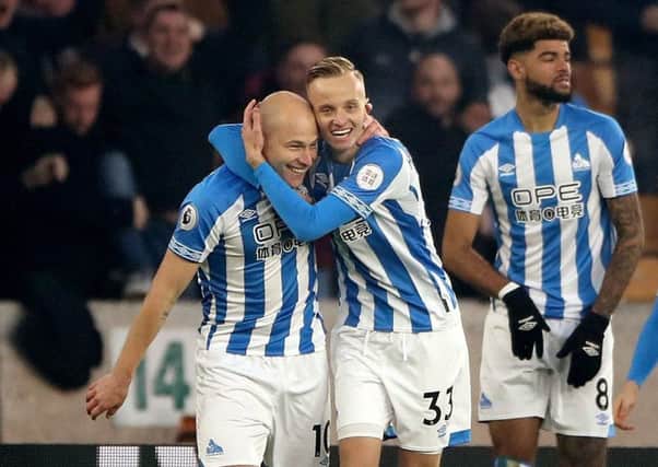 KEEP BELIEVING: Florent Hadergjonaj celebrates with goalscorer Aaron Mooy, left, during the recent win against Wolves. Picture: Nick Potts/PA