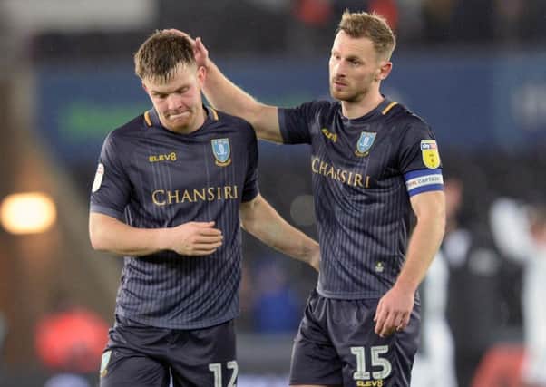 Sheffield Wednesday captain Tom Lees consoles Jordan Thorniley after defeated at Swansea City (Picture: Steve Ellis).