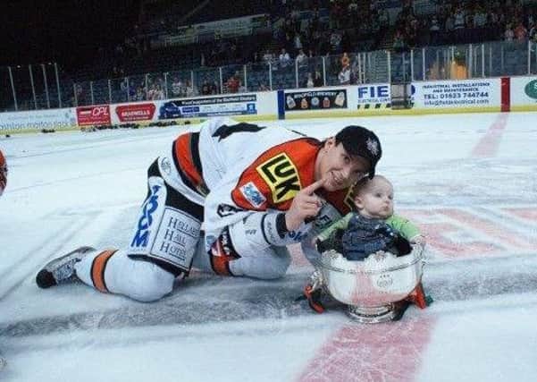 Mark Thomas, back in his days playing with Sheffield Steelers, with son Bailey,