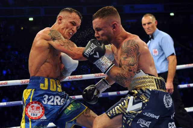 Josh Warrington catches  Carl Frampton full on during their pulsating IBF Featherweight World title fight at Manchester Arena on Saturday night. Picture: Steve Riding.