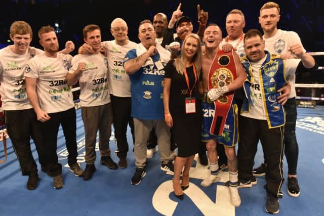 TOP MAN: Josh Warrington with his team and supporters in Manchester after retaining his IBF world featherweight title against Carl Frampton. Picture: Steve Riding.
