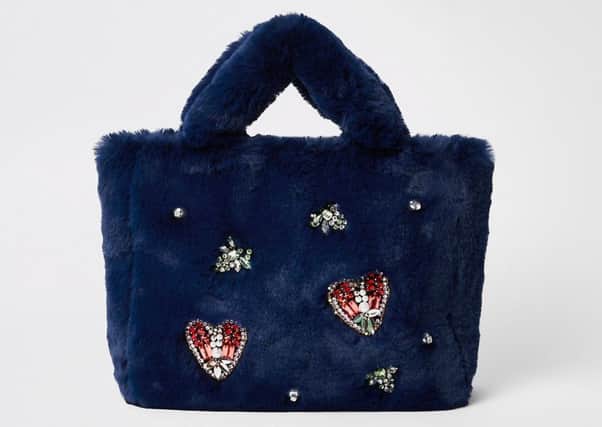 Navy faux fur jewel embellished shopper bag, Â£45, at River Island.