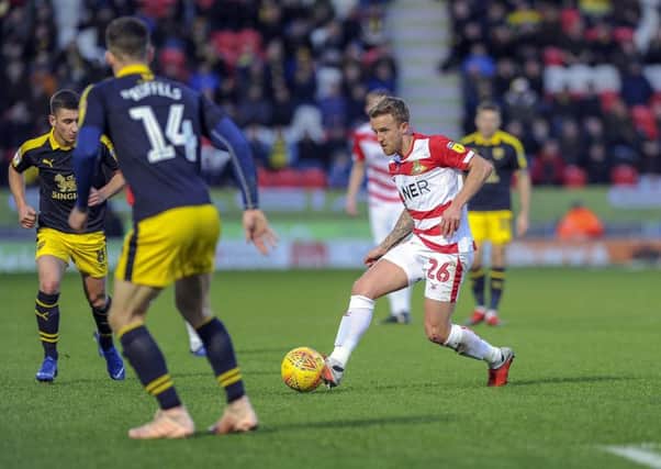 James Coppinger drives forward during his 600th game for Doncaster Rovers against Oxford United on Saturday (Picture: Scott Merrylees).