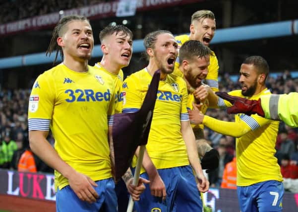 Leeds United celebrate at Villa Park where they came back from two goals down to beat Aston Villa 3-2 on Sunday (Picture: Nick Potts/PA Wire).