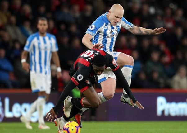 BKey player: Huddersfield Town's Aaron Mooy.