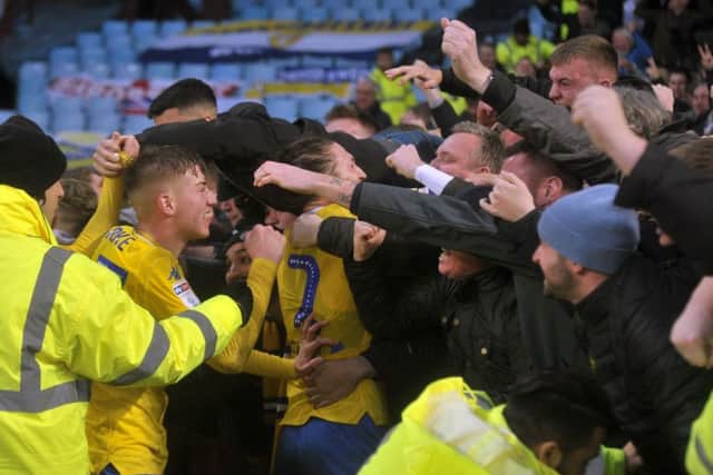 Jack Clarke celebrates with the Leeds fans after Sunday's comeback victory