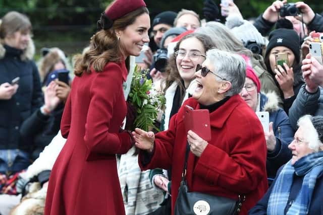 The Duchess of Cambridge speaks with Jill Lee, 71, from Cambridge as she arrives to attend the Christmas Day morning church service at St Mary Magdalene Church in Sandringham, Norfolk. Picture: Joe Giddens/PA Wire