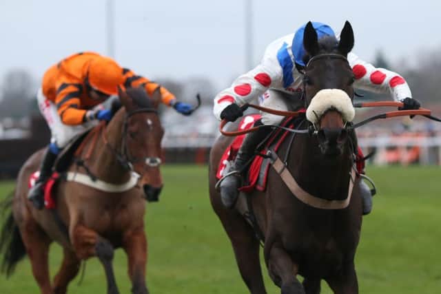 Clan Des Obeaux and Harry Cobden lead Thistlecrack and Tom Scudamore home to win the King George Chase at Kempton.