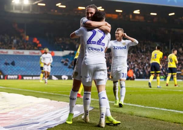 Leeds United's players celebrate their opening goal. Picture: John Walton/PA