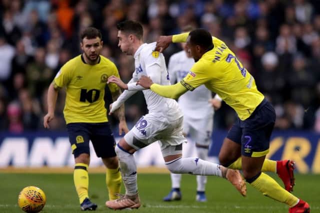 Leeds United's Pablo Hernandez (centre) battles for possession of the ball with Blackburn Rovers' Ryan Nyambe. Picture: John Walton/PA