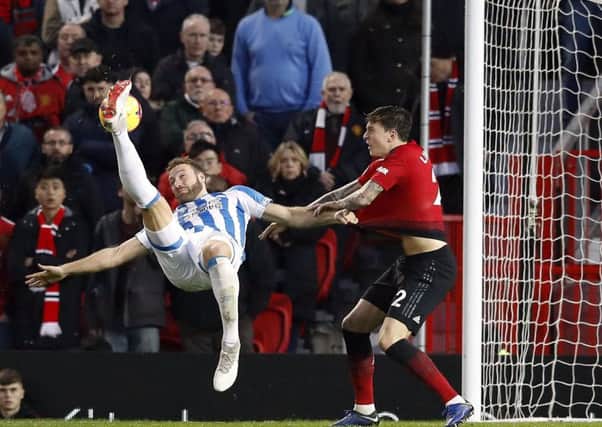 Huddersfield Town's Laurent Depoitre attempts an overhead kick during the Premier League match at Old Trafford (Picture: Martin Rickett/PA)