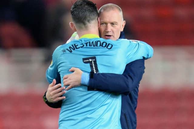 A delighted Owls keeper Keiren Westwood at the final whistle with caretaker manager Lee Bullen (Picture: Steve Ellis)