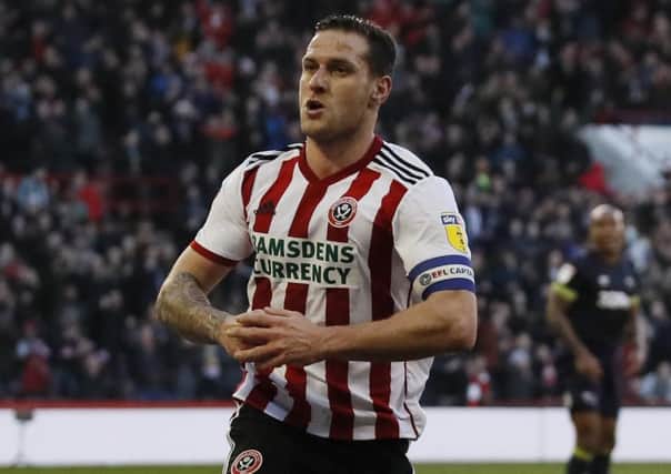 On target: Blades captain Billy Sharp celebrates his goal against Derby.