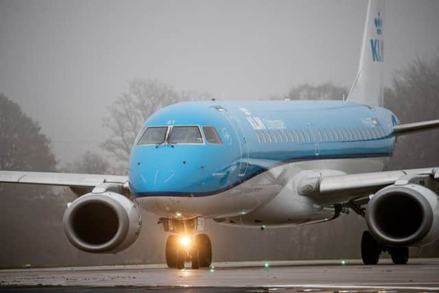 A KLM jet lands in poor weather at Leeds Bradford Airport. Picture by Charlotte Graham.