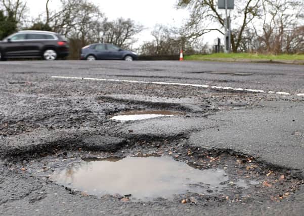 More than half a million potholes were reported to local councils last year.