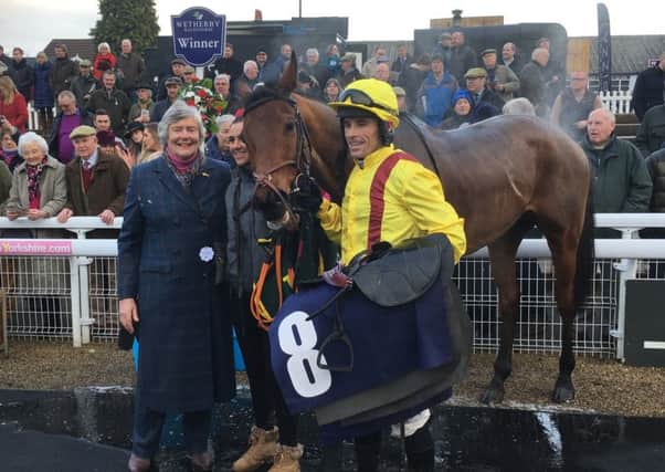 Cracking Find with owner Ann Ellis and jockey Sean Quinlan after their Castleford Chase triumph.