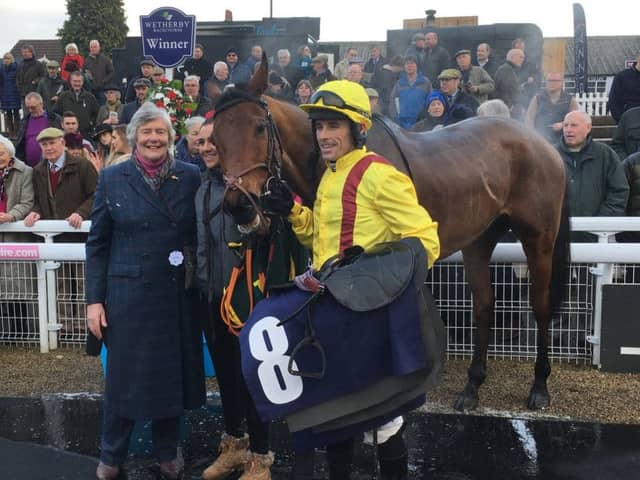 Cracking Find with owner Ann Ellis and jockey Sean Quinlan after their Castleford Chase triumph.