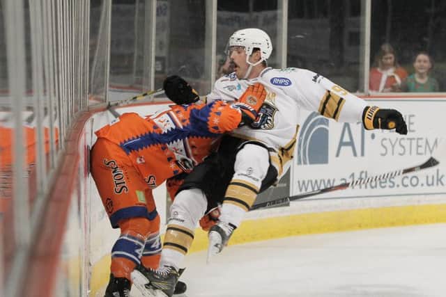 TAKE THAT: Sheffield Steelers' Ryan Martinelli gets to grips with Nottingham's Jaynen Rissling. Picture: Hayley Roberts