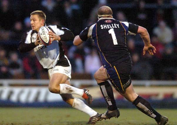 World Cup winner:  Jonny Wilkinson goes past Mike Shelley in the Leeds Tykes v Newcastle Falcons match, which attracted a record Headingley crowd 14 years ago.