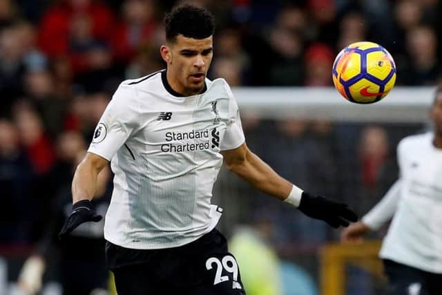 Burnley's James Tarkowski (front) and Liverpool's Dominic Solanke battle for the ball during the Premier League match at Turf Moor, Burnley. (Picture: Martin Rickett/PA Wire)