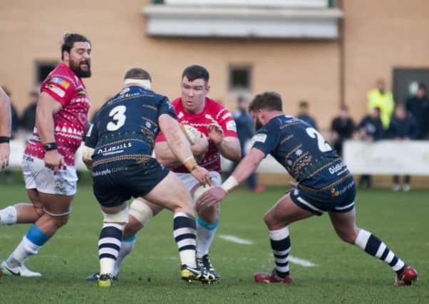 On the charge: Doncaster's Oliver Steadman tests the Carnegie defence.