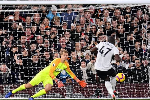 LONDON, ENGLAND - DECEMBER 29: Jonas Lossl of Huddersfield Town saves a  penalty from Aboubakar Kamara of Fulham during the Premier League match between Fulham FC and Huddersfield Town at Craven Cottage on December 29, 2018 in London, United Kingdom. (Photo by Justin Setterfield/Getty Images)