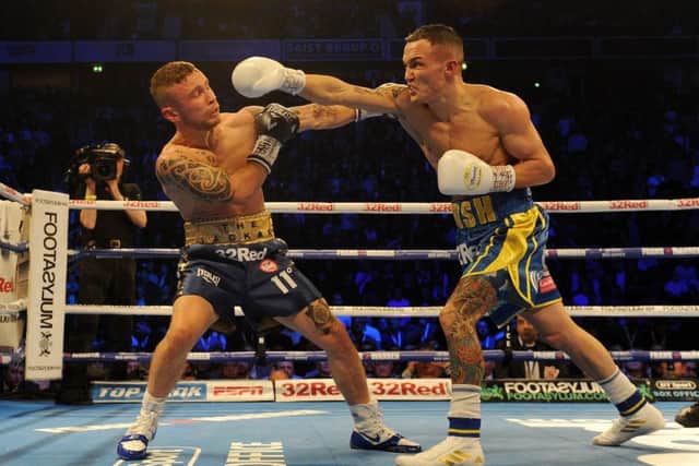 CHAMPION: 
Josh Warrington attacks attacks Carl Frampton during their memorable bout at Manchester Arena earlier this month.