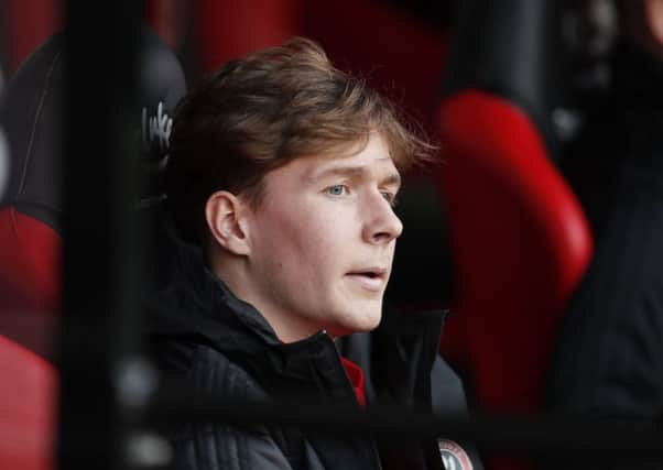 Watching brief: Kieran Dowell watches the Blades from the dugout.