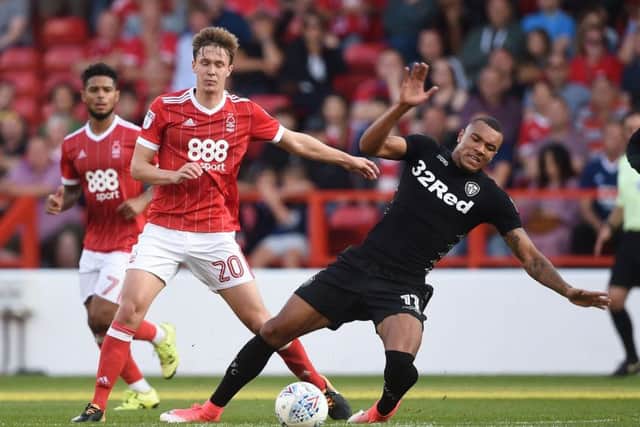 Kieran Dowell (left), in action while on loan at Nottingham Forest, battles with Leeds United's Jay-Roy Grot at the City Ground last season. Picture: Joe Giddens/PA