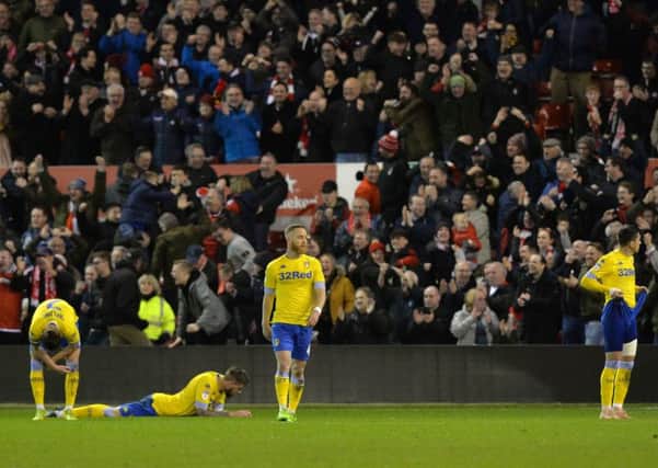 KILLER BLOW: Leeds' players show their dejection after Nottingham Forest celebrate their fourth goal.  Picture: Bruce Rollinson