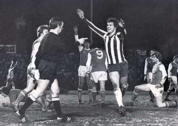 John Lowey celebrates after scoring Sheffield Wednesday's second and equalising goal in the third FA Cup replay against Arsenal in January 1979.