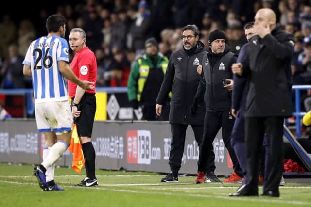EARLY BATH: Huddersfield Town's Christopher Schindlershows his frustration to manager David Wagner at the John Smith's Stadium. Picture: Martin Rickett/PA