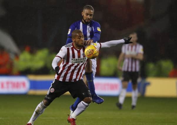 Michael Hector of Sheffield Wednesday tackles Leon Clarke of Sheffield United during the last Steel City derby (Picture: Simon Bellis/Sportimage)