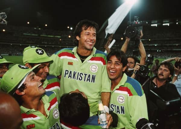 Champions: Pakistan captain Imran Khan celebrates with team-mates after the 1992 World Cup final victory against England at MCG on March 25, 1992. Picture: Tony Feder/Allsport/Getty Images