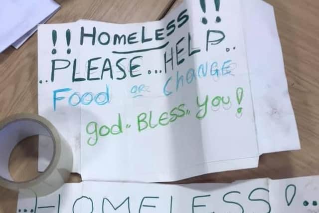 The signs seized from a beggar by police. Photo: West Yorkshire Police/Facebook