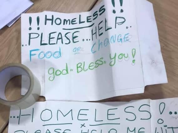 The signs seized from a beggar by police. Photo: West Yorkshire Police/Facebook