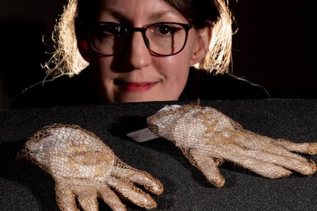 Very fine natural coloured women's straw gloves worked in an open mesh, dating approx. 1800-1850.