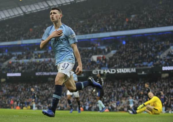 Manchester City's Phil Foden celebrates after scoring against Rotherham.