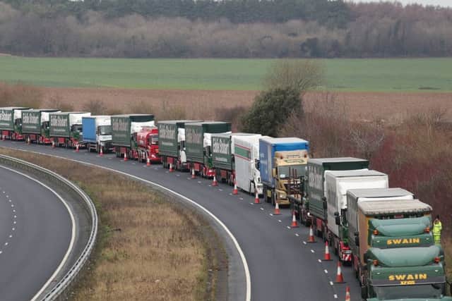 Lorries form up on the A526 outside Dover for the second of two trials at the former Manston Airport site in Kent of a government plan to hold lorries in the event of post-Brexit disruption at the channel ports. Photo: Gareth Fuller/PA Wire