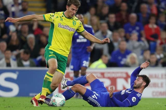 WANTED MAN: Cardiff City's Gary Madine battle for the ball with Norwich City's Christophe Zimmermann last season. Picture: David Davies/PA
