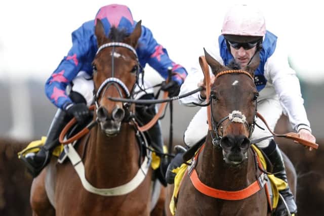 Brian Hughes and Waiting Patiently (right) get the better of the Paddy Brennan-ridden Cue Card in the Ascot Chase.