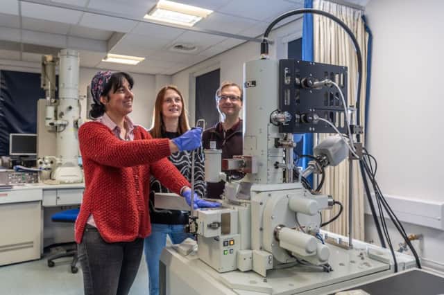 Dr Anita Radini, Emma Tong and Dr Roland Kroeger using an electron microscope at the University of York. Picture by James Hardisty.