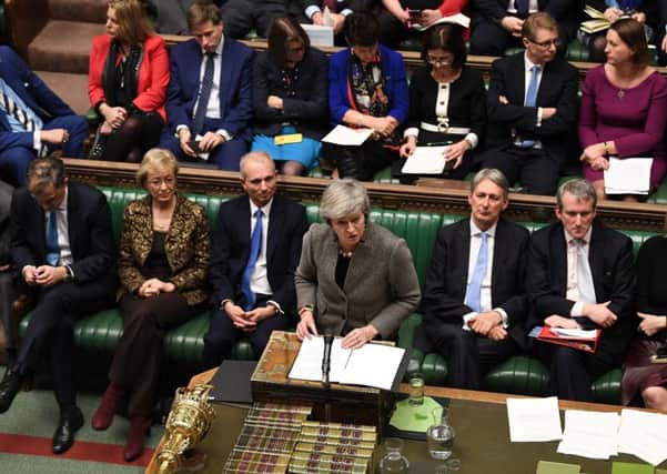 Theresa May addresses MPs during Brexit exchanges.