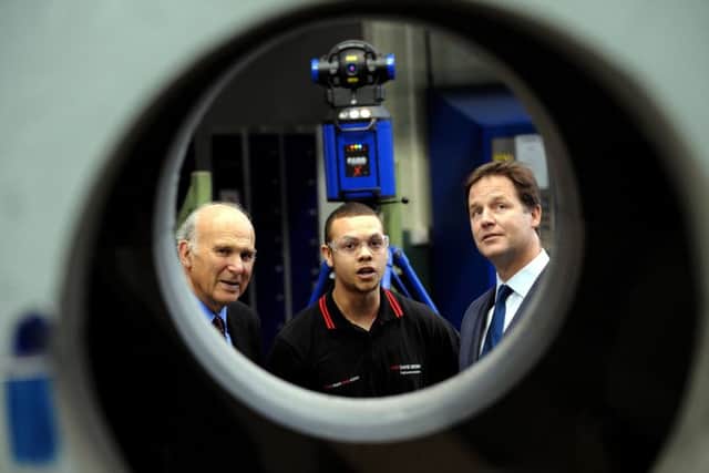 Vince Cable, left, during a visit to Huddersfield when he was Business Secretary.