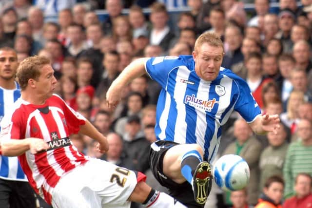 NEW ROLE: Steve Watson, in action for Sheffield Wednesday against Sheffield United's brian Howard at Hillsboroug.